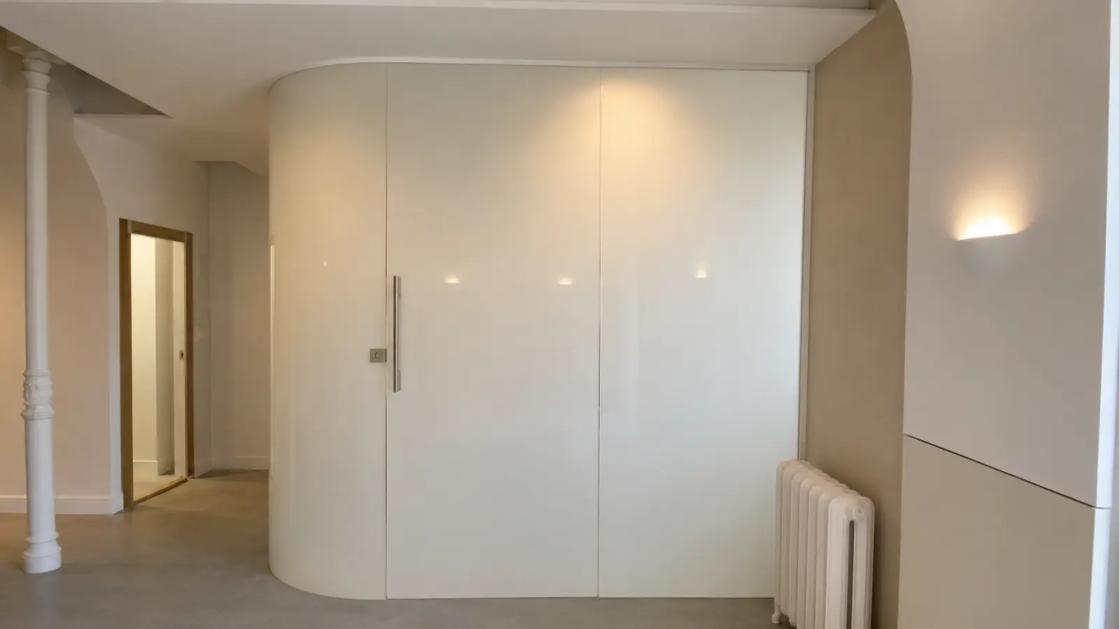 Curved glass enclosure shown in a translucent privacy state after installation