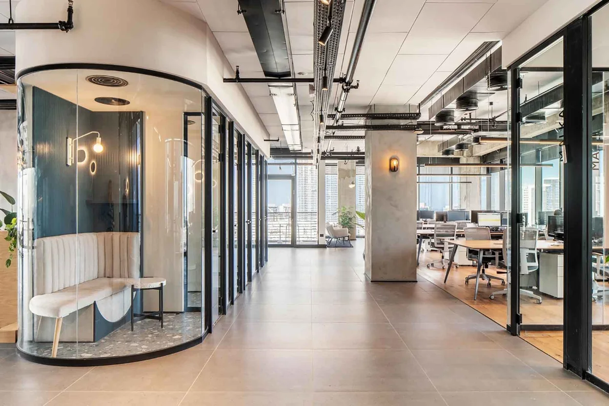 Clear curved office pod with an open view into the seating area